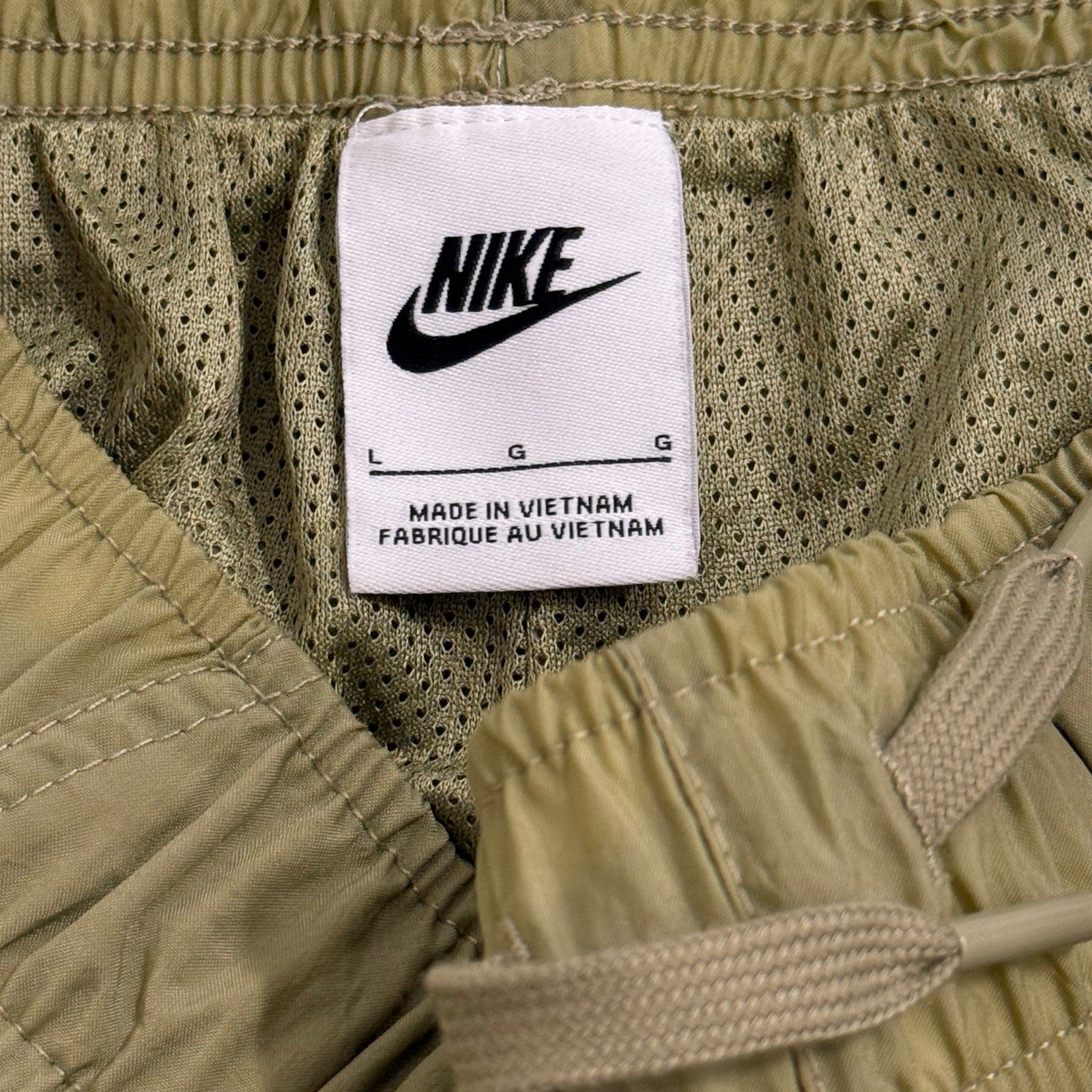 Nike fitted joggers pants for boy in olive green size L